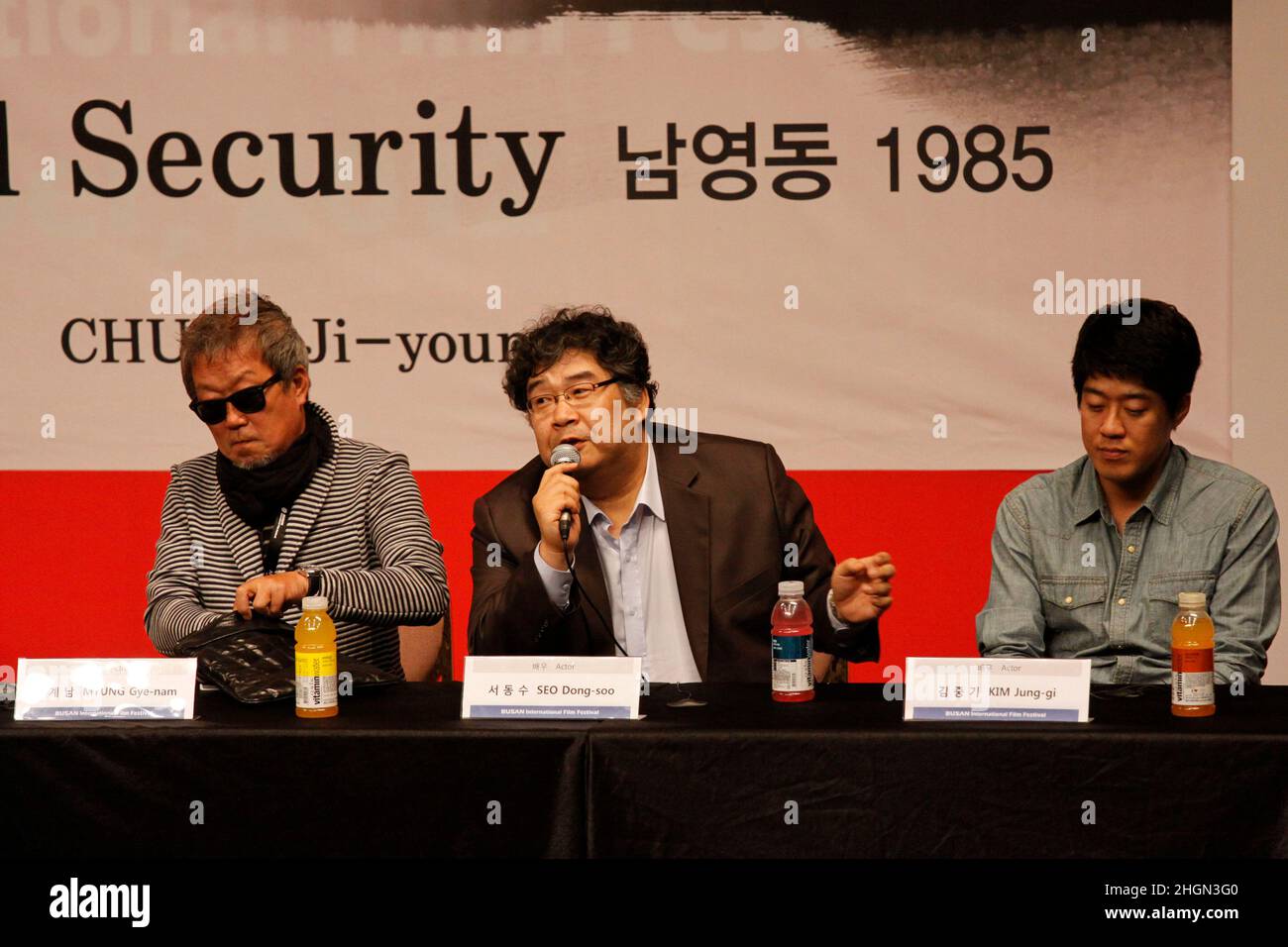 October 6, 2012 - Busan, South Korea : (From lest) Actor Myung Gye Nam, Seo Dong Soo and Kim Jung Gi attend their new film `National Security 1985` Gala Presentation event at the CGV Theater. The film based on the memoir of a democracy activist who was tortured in the 1980s by South Korea's military rulers is provoking discussion about the country's not-so-distant authoritarian past and the influence it will have on this year's presidential election. (Ryu Seung-il / Polaris) Stock Photo